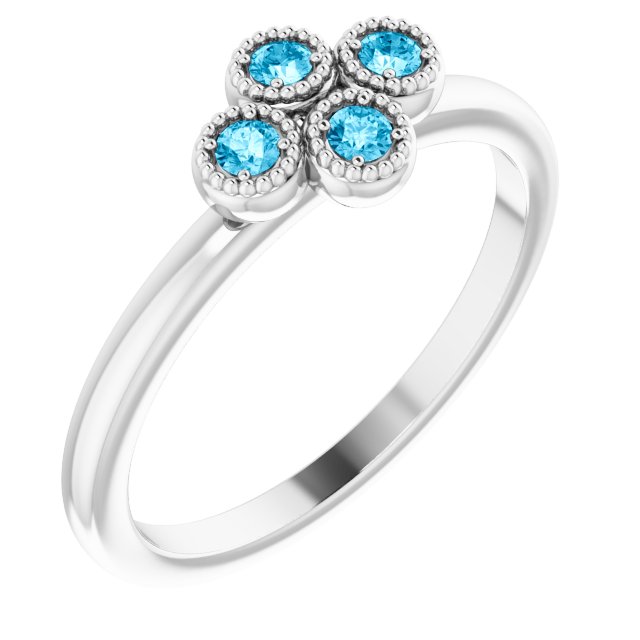 Round Aquamarine Accented Ring in Gold and Platinum