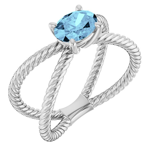 Oval Aquamarine Solitaire Ring in Gold and Platinum