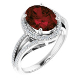 Oval Mozambique Garnet & Diamond Halo Ring in Gold and Platinum