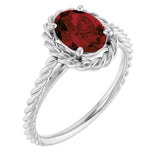 Oval Mozambique Garnet Solitaire Ring in Gold and Platinum