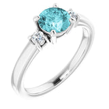 Round Blue Zircon Accented Ring with Diamond Accents in Gold