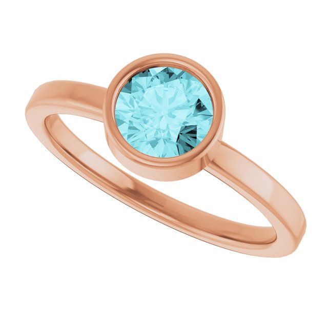 Round Blue Zircon Solitaire Ring in Gold and Platinum