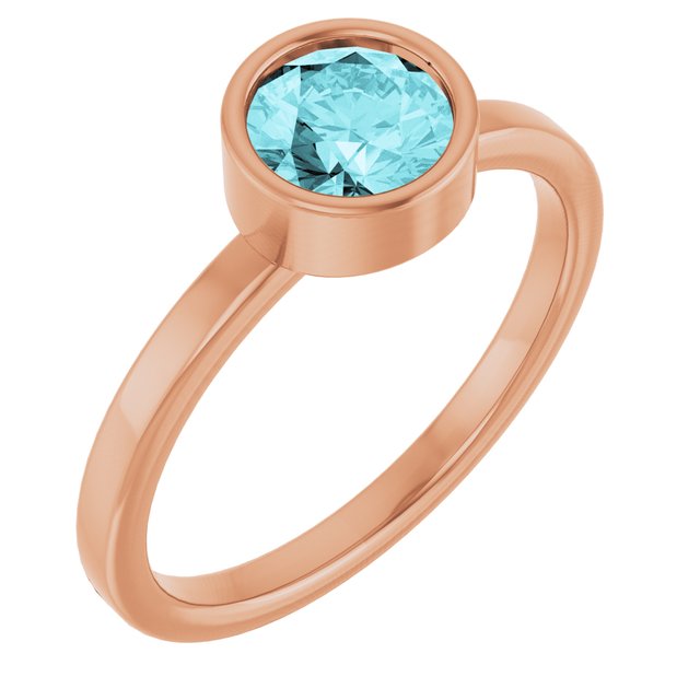 Round Blue Zircon Solitaire Ring in Gold and Platinum