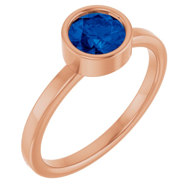 Round Blue Sapphire Solitaire Ring in Gold and Platinum