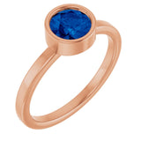 Round Blue Sapphire Solitaire Ring in Gold and Platinum