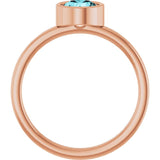 Round Blue Zircon Solitaire Ring in Gold and Platinum