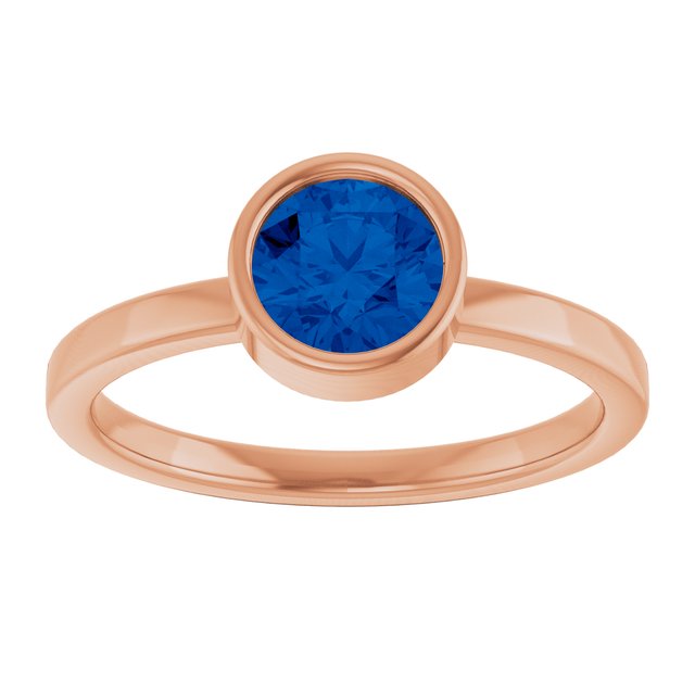 Round Blue Sapphire Solitaire Ring in Gold and Platinum
