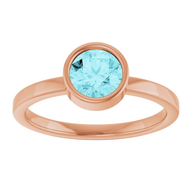 Round Blue Zircon Solitaire Ring in Gold and Platinum