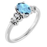 Oval Aquamarine & Diamond Accented Ring in Gold and Platinum