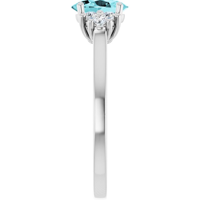 Oval Blue Zircon Accented Ring with Diamond Accents in Gold