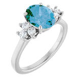 Oval Swiss Blue Topaz Accented Ring with Diamond Accents in Gold