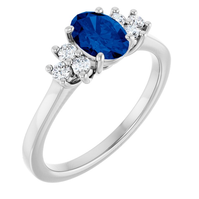 Oval Blue Sapphire Accented Ring with Diamond Accents in Gold