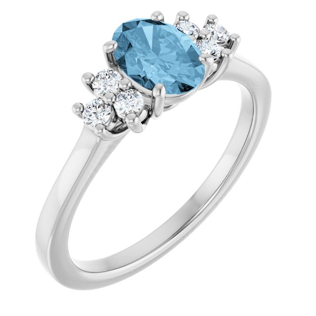 Oval Sky Blue Topaz & Diamond Accented Ring in Gold and Platinum