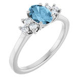 Oval Sky Blue Topaz & Diamond Accented Ring in Gold and Platinum