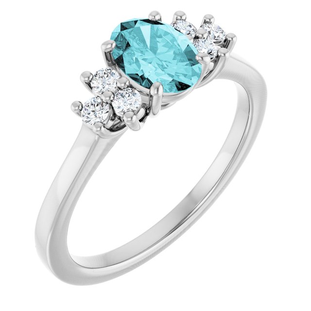 Oval Blue Zircon Accented Ring with Diamond Accents in Gold