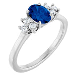 Oval Blue Sapphire Accented Ring with Diamond Accents in Gold