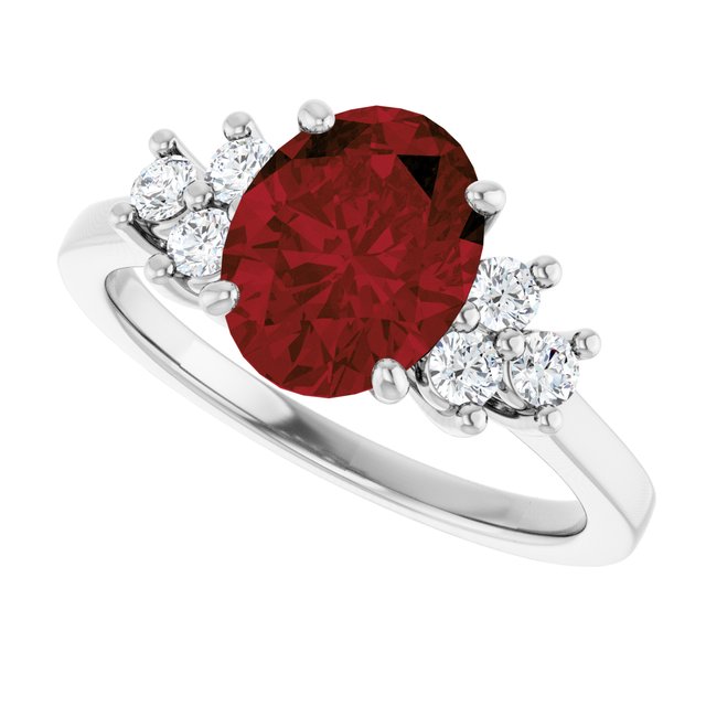 Oval Mozambique Garnet Accented Ring with Diamond Accents in Gold