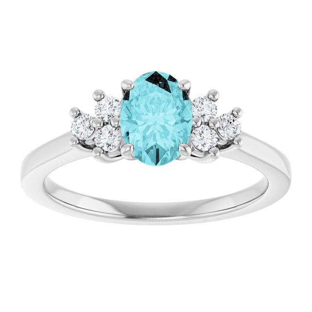 Oval Blue Zircon Accented Ring with Diamond Accents in Gold