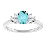Oval Blue Zircon Accented Ring with Diamond Accents in Gold
