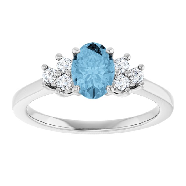Oval Sky Blue Topaz & Diamond Accented Ring in Gold and Platinum