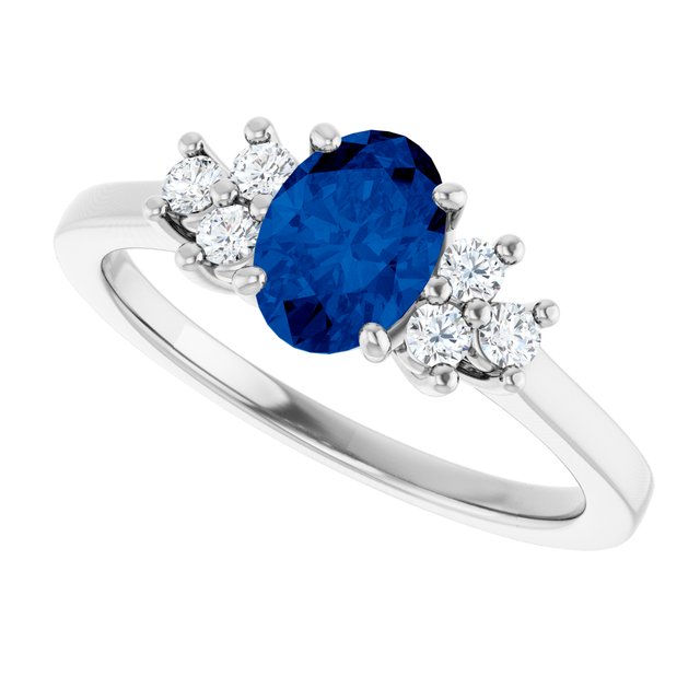 Oval Blue Sapphire Accented Ring with Diamond Accents in Gold