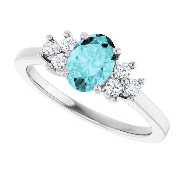 Oval Blue Zircon Accented Ring with Diamond Accents in Gold