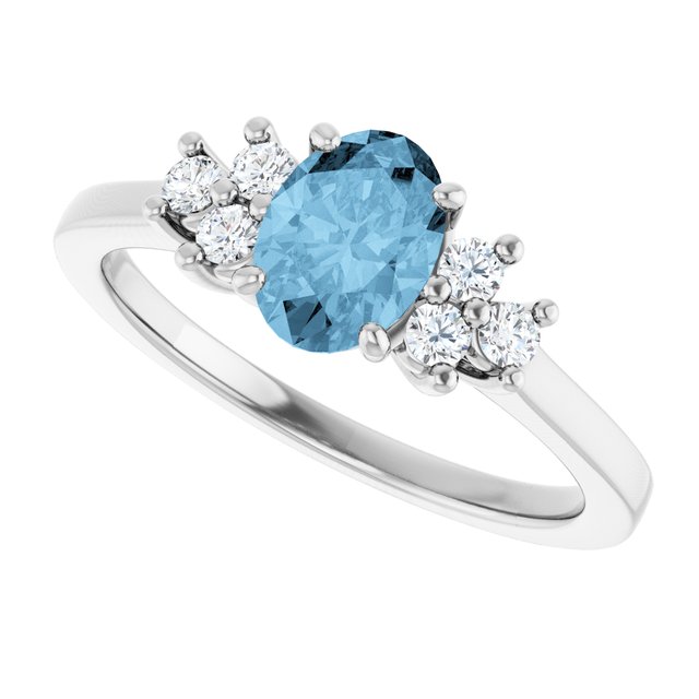 Oval Sky Blue Topaz & Diamond Accented Ring in Gold and Platinum