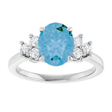 Oval Swiss Blue Topaz Accented Ring with Diamond Accents in Gold