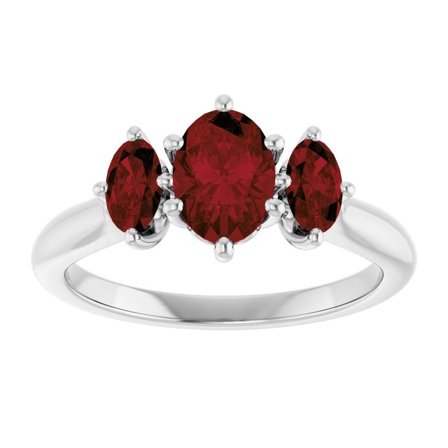Oval Mozambique Garnet Three Stone Ring in Gold and Platinum