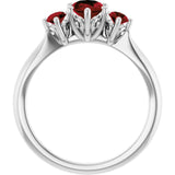Oval Mozambique Garnet Three Stone Ring in Gold and Platinum