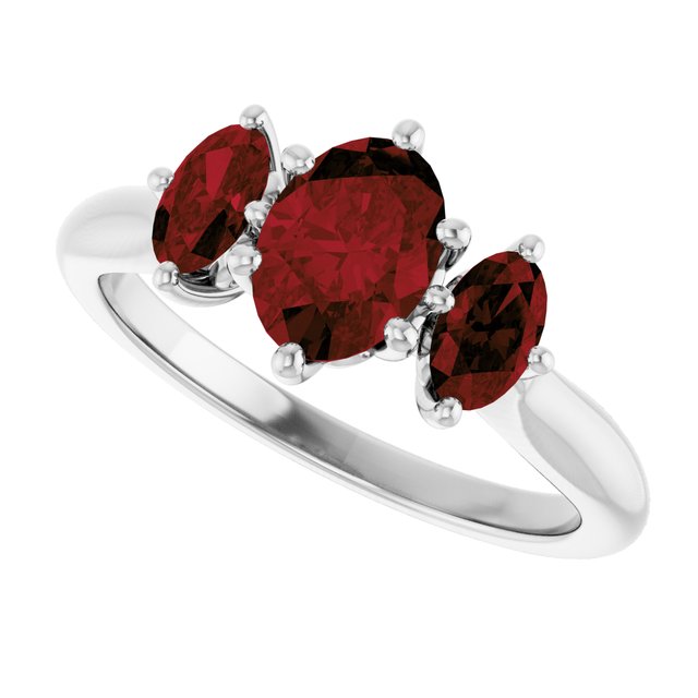 Oval Mozambique Garnet Three Stone Ring in Gold and Platinum