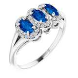 Oval Blue Sapphire & Diamond Three Stone Ring in Gold and Platinum