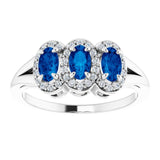 Oval Blue Sapphire & Diamond Three Stone Ring in Gold and Platinum