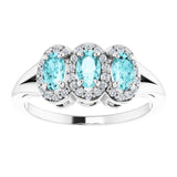 Oval Blue Zircon & Diamond Three Stone Ring in Gold and Platinum