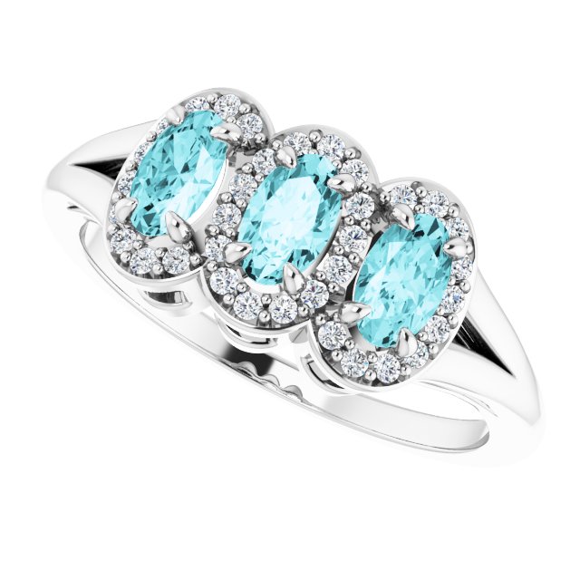 Oval Blue Zircon & Diamond Three Stone Ring in Gold and Platinum