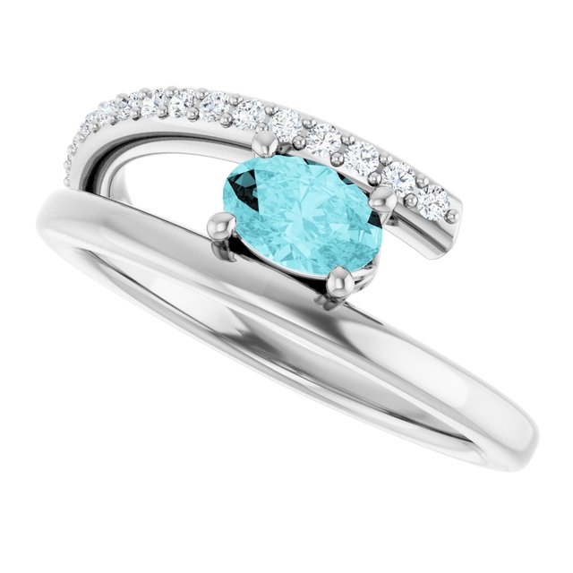 Oval Blue Zircon & Diamond Accented Ring in Gold and Platinum