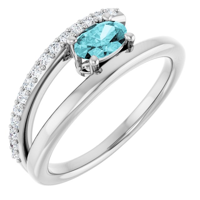 Oval Blue Zircon & Diamond Accented Ring in Gold and Platinum