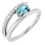 Oval Blue Zircon & Diamond Accented Ring in Gold and Platinum