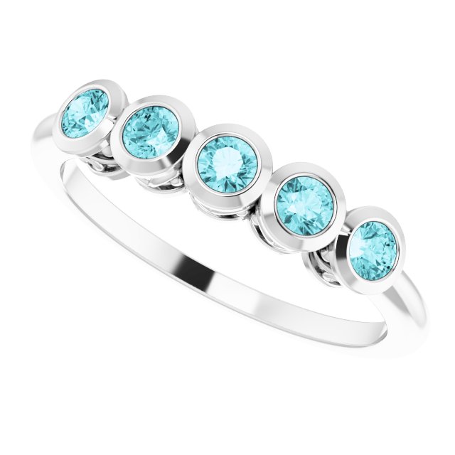 Round Blue Zircon Accented Ring in Gold and Platinum