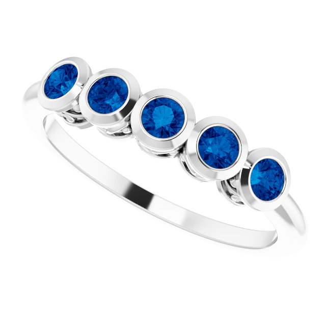 Round Blue Sapphire Accented Ring in Gold and Platinum