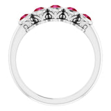 Round Ruby Accented Ring in Gold and Platinum