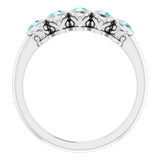 Round Blue Zircon Accented Ring in Gold and Platinum