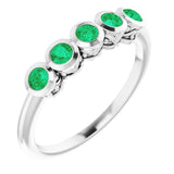 Round Emerald Accented Ring in Gold and Platinum