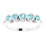 Round Blue Zircon Accented Ring in Gold and Platinum