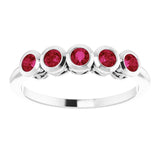Round Ruby Accented Ring in Gold and Platinum