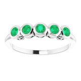 Round Emerald Accented Ring in Gold and Platinum