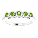 Round Peridot Accented Ring in Gold and Platinum