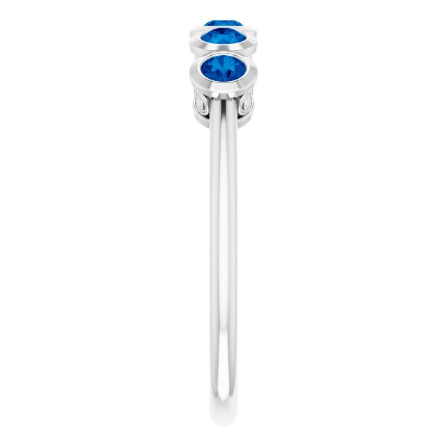 Round Blue Sapphire Accented Ring in Gold and Platinum