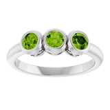 Round Peridot Three Stone Ring in Gold and Platinum