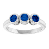 Round Lab-Grown Blue Sapphire Three Stone Ring in White Gold
